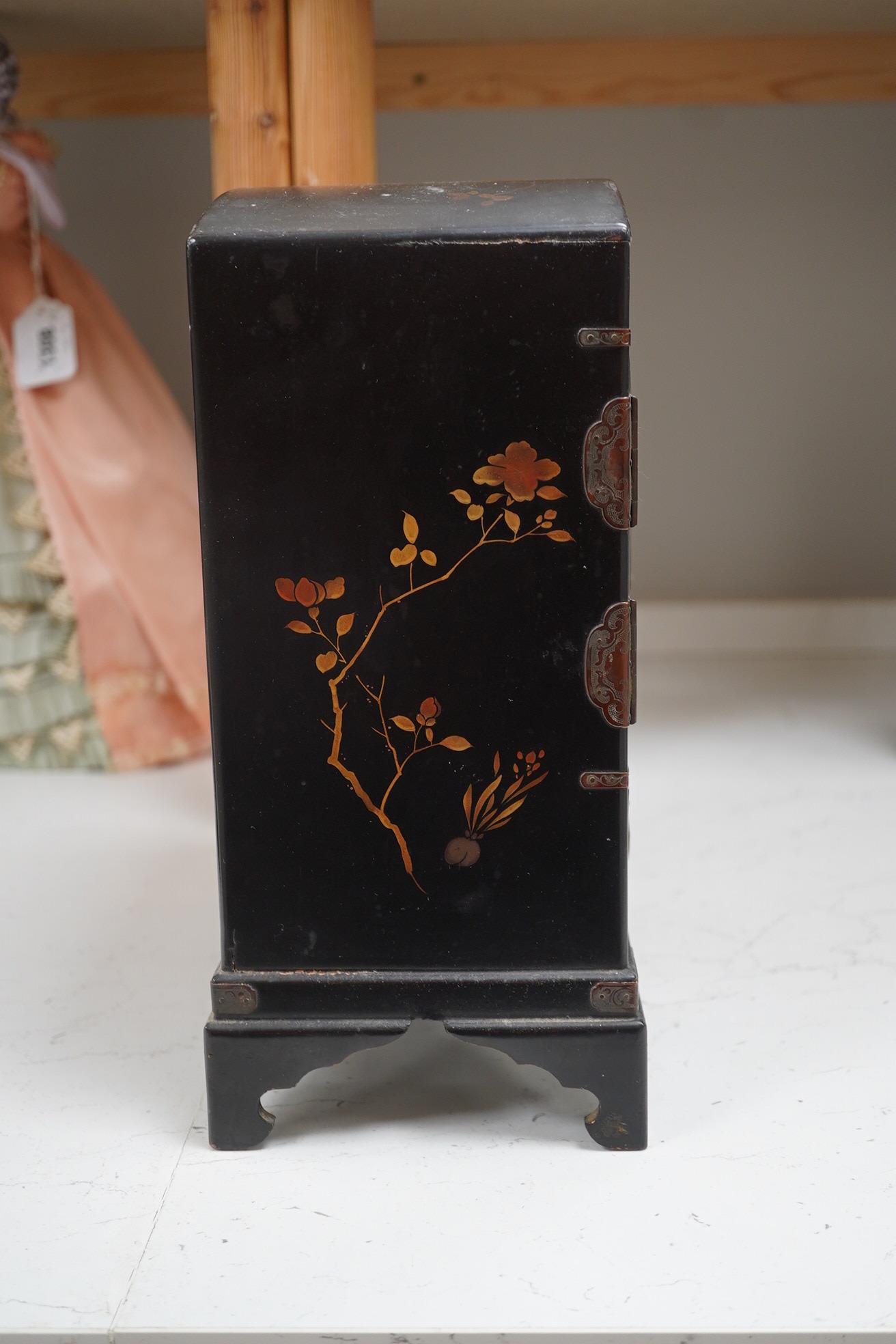 A late 19th early 20th century Japanese lacquer cabinet, 31cm high. Condition - exterior chipped and cracked near the top edge